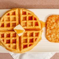 Waffle And Hashbrown · Large Buttermilk Waffle served with butter, syrup and a hash brown patty