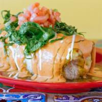 Burritos · All burritos are stuffed with rice and pinto refried beans. They are topped with cheese, let...