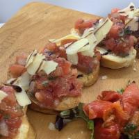 Bruschetta · Diced tomatoes, red onions, garlic, basil, olive oil, Served over crispy Seasoned Italian br...