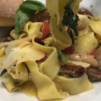 Siena Style Fresh Tagliatelle · Italian sausage, tomatoes, broccoli rabe, garlic, and oil.