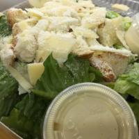 Clasic Caesar Salad · Crispy romaine hearts, croutons, homemade caesar dressing, and shaved parmesan cheese.