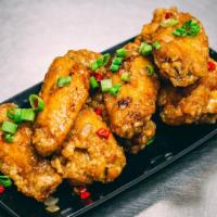 Hen Wings · Fried wings in house caramelized sauce with minced shallots, garlic and Thai chili.