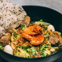 Mi Quang · Danang style turmeric rice noodles with pork , prawn , quail egg , sesame shrimp crackers