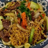 Мі Xao Mem · Stir fry egg noodles with egg, onion, scallion,carrots, bean sprout and bok choy.