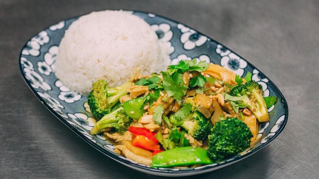 Stir Fry Curry · Broccoli, carrots,onion,bell pepper,mushrooms,baby corn,bamboo slice, wok tossed in coconut curry sauce