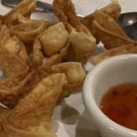 Crab Rangoon (6) · Crabmeat with cream cheese in crispy wonton wraps served with sweet & sour sauce.