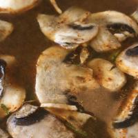 Tom Yum · Thai-style soup with delicate spicy herbs, mushrooms, and lime juice.
