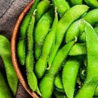 Edamame · Lightly seasoned boiled green soybean pods salted.