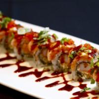 Phoenix Roll · Crab stick and tempura crumbs with spicy mayo wrapped with seared salmon, touch of unagi sau...