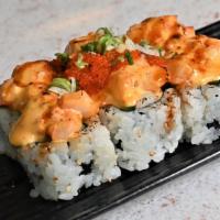 Volcano Roll · Crab stick, tobiko, avocado, and cucumber topped with spicy scallop and toasted spicy mayo.