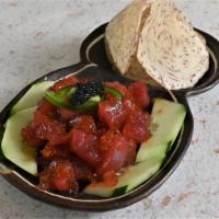 Tuna Tartare · With black tobiko and taro chips.