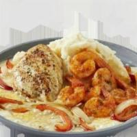 Sizzling Chicken & Shrimp · Garlic-marinated chicken breast with shrimp tossed in marinara. Served over melted cheese wi...