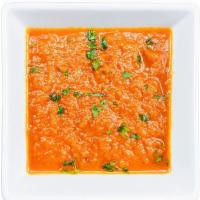 Carrot Wot · Minced carrot stewed in savory & spicy berbere sauce.