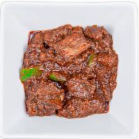 Goat Wot · Mild. Braised goat stew in a mild onion, garlic and ginger sauce.