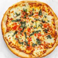 Margherita Flatbread · Whole sliced tomato, fresh mozzarella cheese, and basil topped with a drizzle of extra virgi...