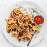 Fried Calamari · A classic fried tender squid and fried sliced jalapeños served with pesto aioli and zesty to...