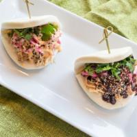 Chicken Bao Buns · Two steamed buns with marinated shredded chicken, pickled red onion, cilantro and choice of ...