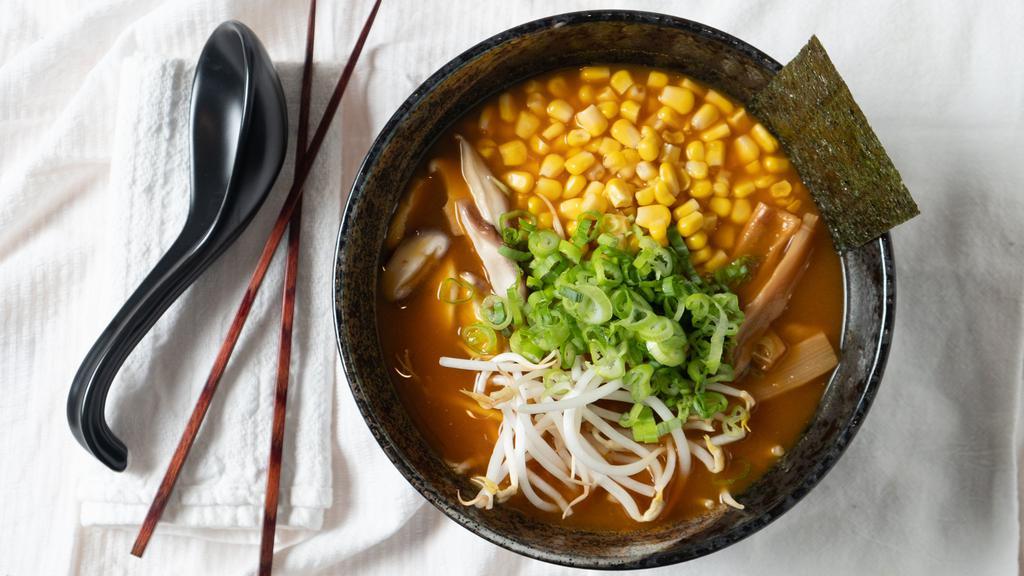 Miso · Vegetable broth with fermented soybean paste, wavy noodles, shiitake mushrooms, bamboo shoots, corn, bean sprouts, garnished with scallions, and nori.