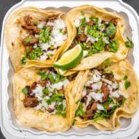 Taco Combo / · 4 tacos of your choice beef, chicken or pork served with rice and beans.