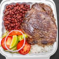 Carne Asada / Steak · Servido con arroz, frijoles pintos, y ensalada / Served with rice, pinto beans, and salad.