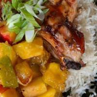 Pork Chops & Mango · Grilled BBQ glazed pork chops over basmati and kale.  Topped with a sweet peach and mango ch...