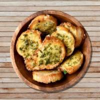 Garlic Bread · House-made signature garlic bread, served with Romano lightly dipped in olive oil and marina...