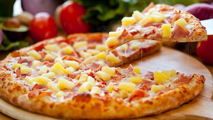 Hawaiian Pizza · Our secret recipe pizza sauce loaded with ham, pineapple chunks and topped with an extra amount of our special blend of 100% fresh natural cheeses.