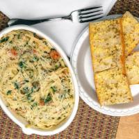 Chicken Fettuccine Alfredo · Fettuccine noodle with Alfredo sauce and grilled chicken, broccoli, mushroom and shredded pa...