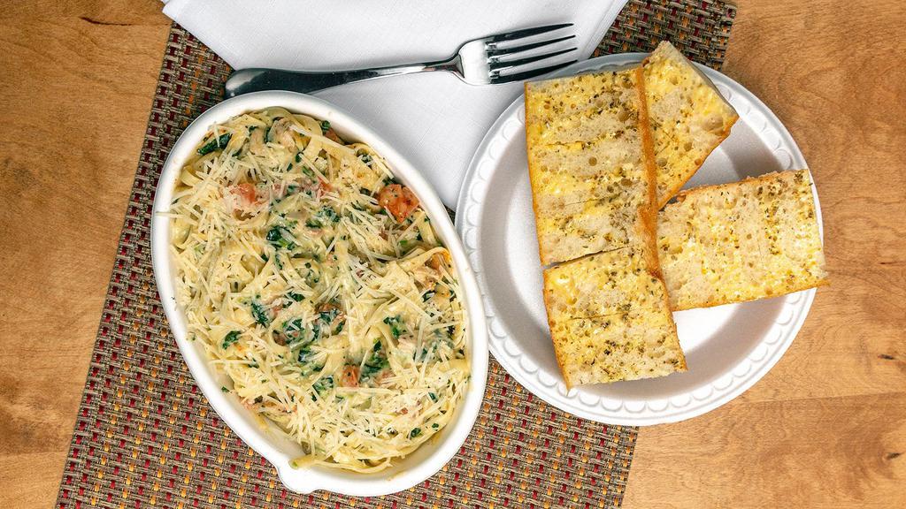 Chicken Fettuccine Alfredo · Grilled marinated chicken breast, sautéed broccoli, and mushrooms in our creamy alfredo sauce served over fettuccine, topped with shredded parmesan cheese.