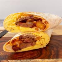 Wake N’ Bake Burrito · Smoked brisket, crispy tots, two scrambled eggs, melted cheese, caramelized onions.