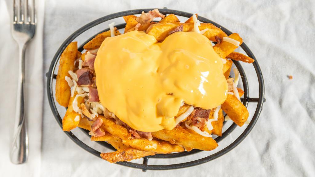 Eagles Fries · Topped with Bacon, Mozzarella, Cheese Whiz, & Ranch Dressing on the side