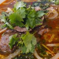B1- Bun Bo Hue · Spicy Beef soup Hue style , beef, steam pork roll