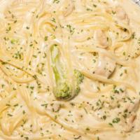 Fettuccine Alfredo · Salad garlic bread, parmesan cheese and melted cheese.