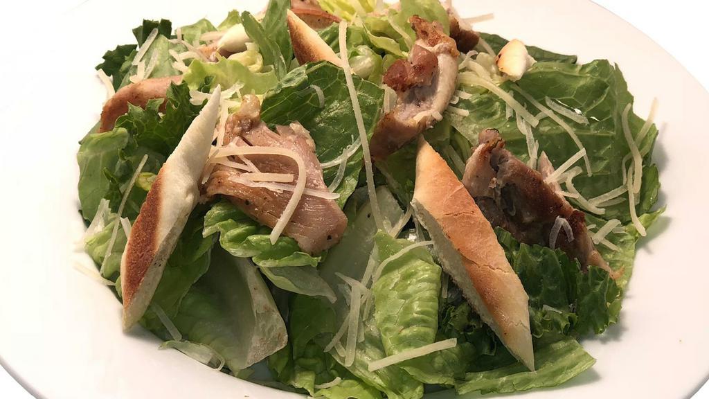 House Caesar Salad With Chicken · Roasted chicken on crisp romaine, our housemade Caesar dressing with house croutons, and Parmesan cheese.