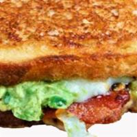 Tbg · Hand-carved turkey, bacon, and guacamole. Served between melted provolone on our grilled sto...
