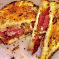 Reuben Griller · A generous portion of pastrami sautéed with sauerkraut/sweet relish mix. Topped with melted ...
