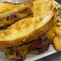Spicy Pastrami Griller · pastrami, provolone, spicy Kenai cheese loaded on our stone baked white bread.  Comes with g...