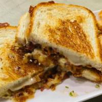 Girdwood Griller · Our homemade savory bacon jam melted with rich, melted brie, provolone, and loaded on our st...