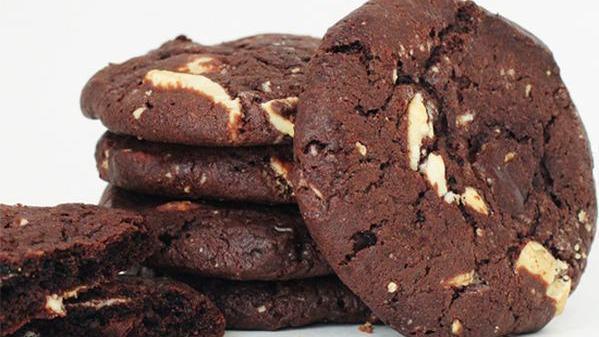 Triple Chocolate - 1/2 Dozen · A special blend created for chocolate lovers. This sweet treat consists of Dutch cocoa, white chocolate, and thick semisweet chips. It's our richest chocolate cookie ever!