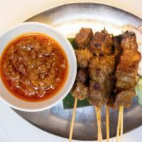 Panang Satay Beef · Marinated beef on skewers, charcoal grilled to perfection. Served with Malaysian specialty p...