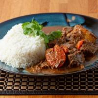 Stewed Beef · Simmered in wine with potatoes, carrots, sofrito.
