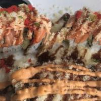 007 Roll · Inside: shrimp tempura, mango, cream cheese and avocado. Outside: salmon, spicy kani crunch ...