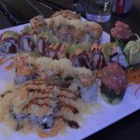 Red Dragon Roll · Inside: tuna and jumbo lump crab. Outside: tuna, avocado, spicy sauce and wasabi tobiko.