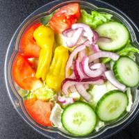 Garden Salad · Lettuce, tomato, cucumber, onion and pepperoncini with two sides of our homemade Italian dre...