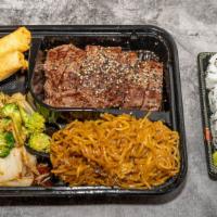 Ny Strip Bento Box 牛排便当    · Served with one California Roll, 2 spring rolls,  mixed vegetables and white rice.