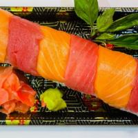 Rainbow Roll 彩虹卷 · Cucumber, imitation crab and avocado topped with Salmon and Tuna.