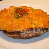 Shitake Kaiyaki · Crab, scallops, flying-fish roe and spicy mayo baked on a portabella mushroom