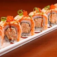 Salmon Torch Roll · Torched salmon, spicy crab, flying-fish roe, tempura flakes and spicy mayo. Served with eel ...