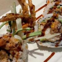 Spider Roll · Soft shell crab, avocado, cucumber and flying-fish roe. Served with eel sauce (gluten free N...