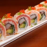 Triple Torch Roll · Torched tuna, salmon, yellowtail and flying-fish roe on top of california roll